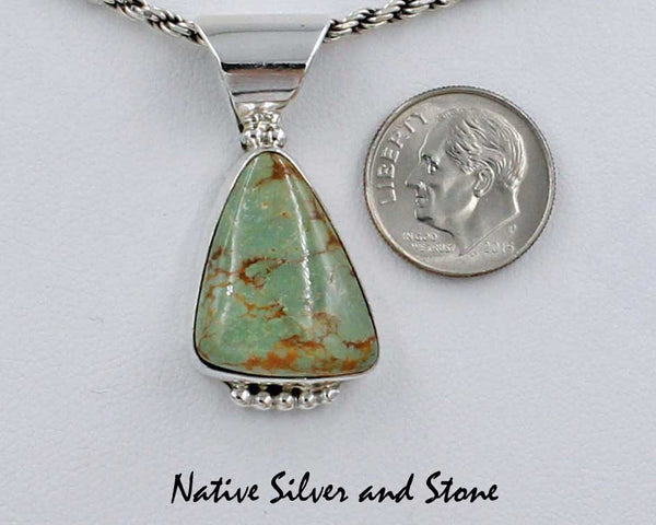 Z Gene & Martha Jackson<br>Both Deceased<br>Navajo<br>1-7/16" Pendant (Only)<br>Natural Green Turquoise Triangle<br>Silver Beaded Bottom