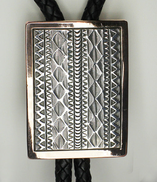 Z Randy Secatero & Sylvana Apache<br>Navajo -Bola/Bolo<br>Large - Various Designs<br>Copper with Oxidized Silver Overlay and Stamping<br>Heavy Leather Braiding