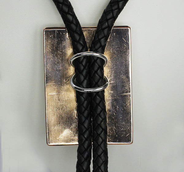 Z Randy Secatero & Sylvana Apache<br>Navajo -Bola/Bolo<br>Large - Various Designs<br>Copper with Oxidized Silver Overlay and Stamping<br>Heavy Leather Braiding