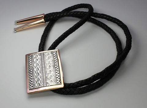 Z Randy Secatero & Sylvana Apache<br>Navajo -Bola/Bolo<br>Large - Various Designs<br>Copper with Oxidized Silver Overlay and Stamping<br>Heavy Leather Braiding