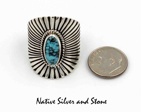 Lyle Piaso - Navajo<br>1-3/16" Ring<br>Sterling Silver "Shield"/"Sunburst"<br>Turquoise w Matrix Oval Cabachon<br>Size 11