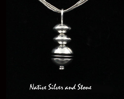 Z Mary Tom - Navajo<br>1-1/16" Pendant<br>9/16" Round Disc Bead<br>Sterling Silver