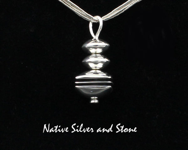 Z Mary Tom - Navajo<br>1-1/16" Pendant<br>9/16" Square Disc Bead<br>Sterling Silver