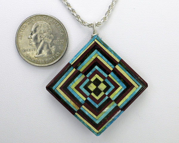 Eugene & Georgia Sanchez<br>Kewa (Santo Domingo)<br>Optical Illusion Inlay Pendant<br>Turquoise, Serpentine, Jet, and Pipestone.