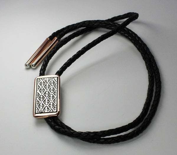 Z Randy Secatero & Sylvana Apache<br>Navajo - Bola/Bolo<br>Small - Diamonds & Dot Designs<br>Copper with Oxidized Silver Overlay and Stamping<br>Heavy Leather Braiding