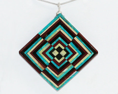 Eugene & Georgia Sanchez<br>Kewa (Santo Domingo)<br>Optical Illusion Inlay Pendant<br>Turquoise, Serpentine, Jet, and Pipestone.