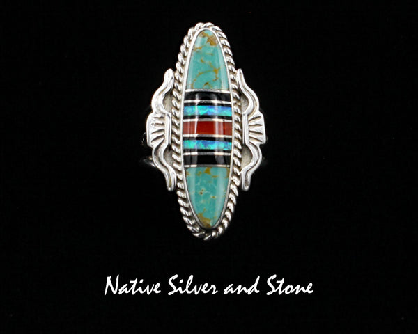 Nataanii (John Charley) - Navajo<br>1-1/2" Ring<br>Multi-Inlay Long Oval<br>Green Turquoise, Onyx, Coral, Opal<br>Size 8