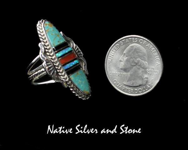 Nataanii (John Charley) - Navajo<br>1-1/2" Ring<br>Multi-Inlay Long Oval<br>Green Turquoise, Onyx, Coral, Opal<br>Size 8