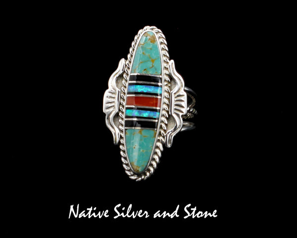 Nataanii (John Charley) - Navajo<br>1-1/2" Ring<br>Multi-Inlay Long Oval<br>Green Turquoise, Onyx, Coral, Opal<br>Size 8