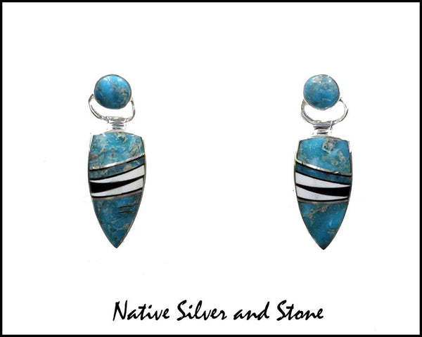 Nataanii, (John Charley) - Navajo<br>1" Earrings - Dangle Post Multi-Inlay <br>Spear with Circle on Swivel Top<br>Long Feathercut<br>Kingman Turquoise, Onyx,<br>& Magnesite<br>Sterling Silver