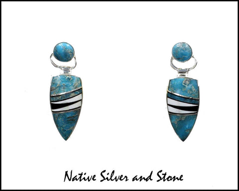 Nataanii, (John Charley) - Navajo<br>1" Earrings - Dangle Post Multi-Inlay <br>Spear with Circle on Swivel Top<br>Long Feathercut<br>Kingman Turquoise, Onyx,<br>& Magnesite<br>Sterling Silver