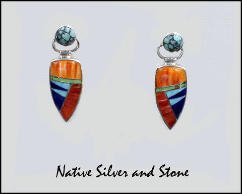 Z Nataanii, (John Charley) - Navajo<br>1" Earrings - Dangle Post Multi-Inlay <br>Spear with Circle on Swivel Top<br>Wide Feathercut<br>Orange & Red Spiny<br>Chinese Turquoise, <br>Lapis, & Gaspiete<br>Sterling Silver