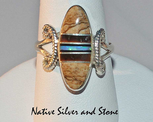 Nataanii  (John Charley) - Navajo<br>Ring<br>Multi-Inlay Short Oval<br>Picture Jasper, Tiger Eye, Onyx, Opal<br>Size 8-1/4