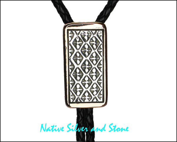 Z Randy Secatero & Sylvana Apache<br>Navajo - Bola/Bolo<br>Small - Diamonds & Dot Designs<br>Copper with Oxidized Silver Overlay and Stamping<br>Heavy Leather Braiding