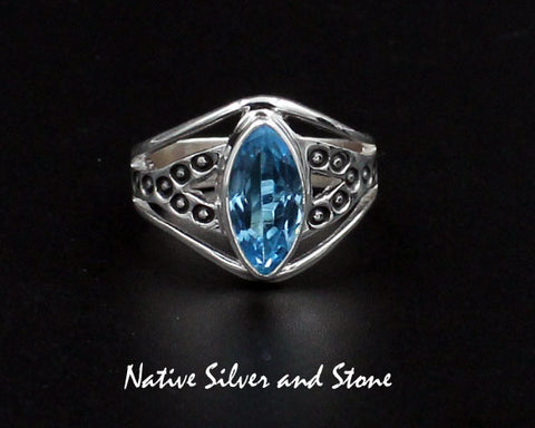 Raymond Coriz - Kewa<br>5/8" Ring<br>Topaz - Blue Faceted<br>Sharp Oval "Marquis"<br>Size 7