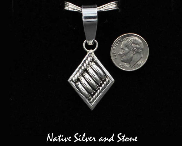 Thomas Charley/Charlie - Navajo<br>1-1/8" Pendant<br>Segmented "Melon"<br> Diamond-Shaped with Twist<br>Sterling Silver